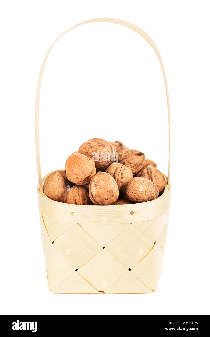 walnut in wooden basket, isolated on white background Stock Photo