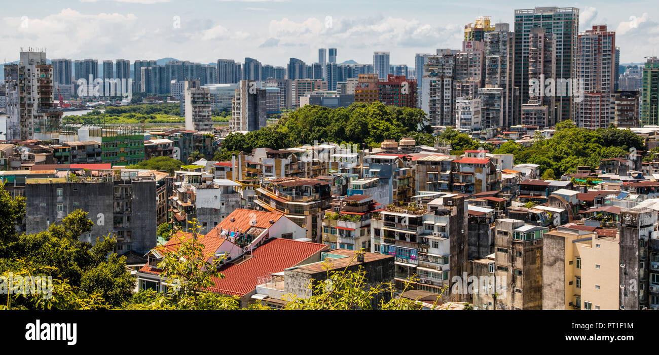 Great panoramic view of the urban landscape of Macau, one of the most densely populated territory worldwide. The idiosyncratic residential buildings... Stock Photo