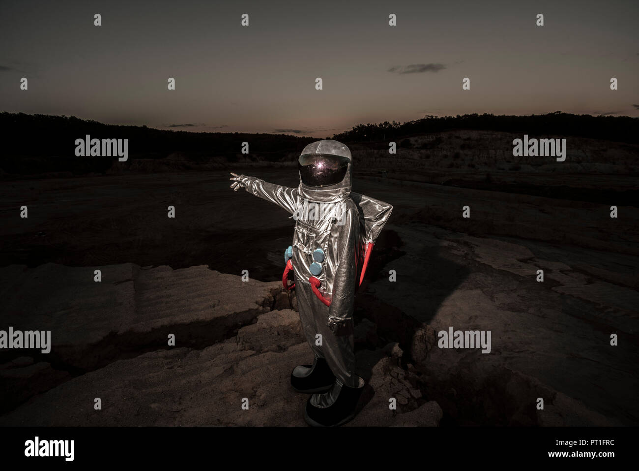 Spaceman Pointing Spaceman pointing at distance at night on a nameless planet Stock Photo ...