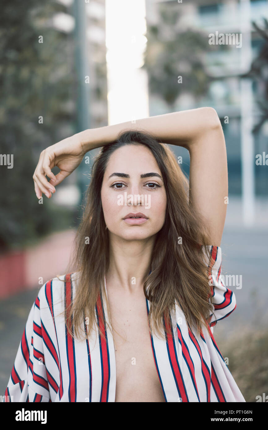 Portrait of woman wearing unbuttoned striped shirt Stock Photo Alamy