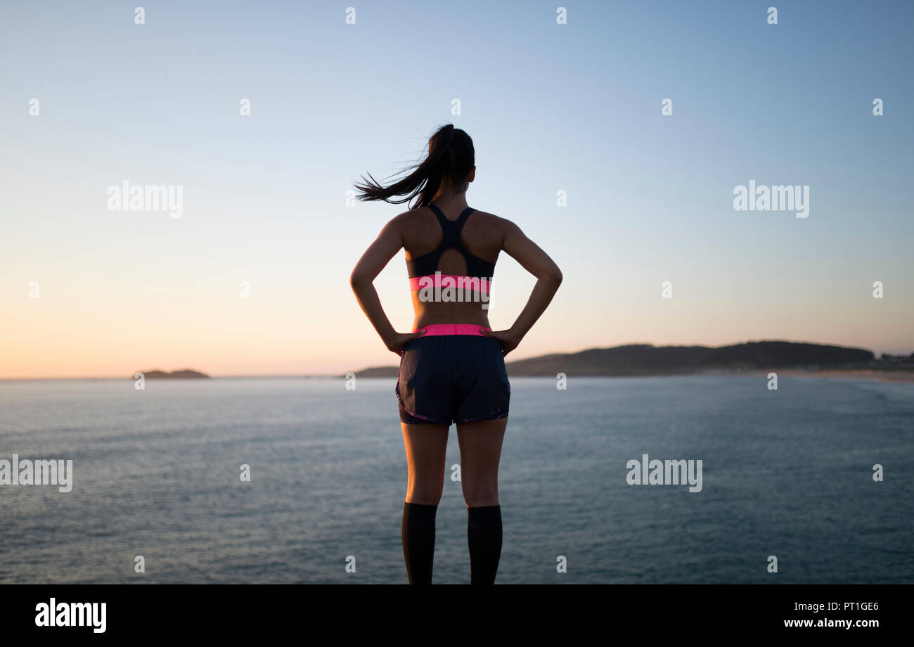 Sportive woman watching sunset hi-res stock photography and images - Alamy