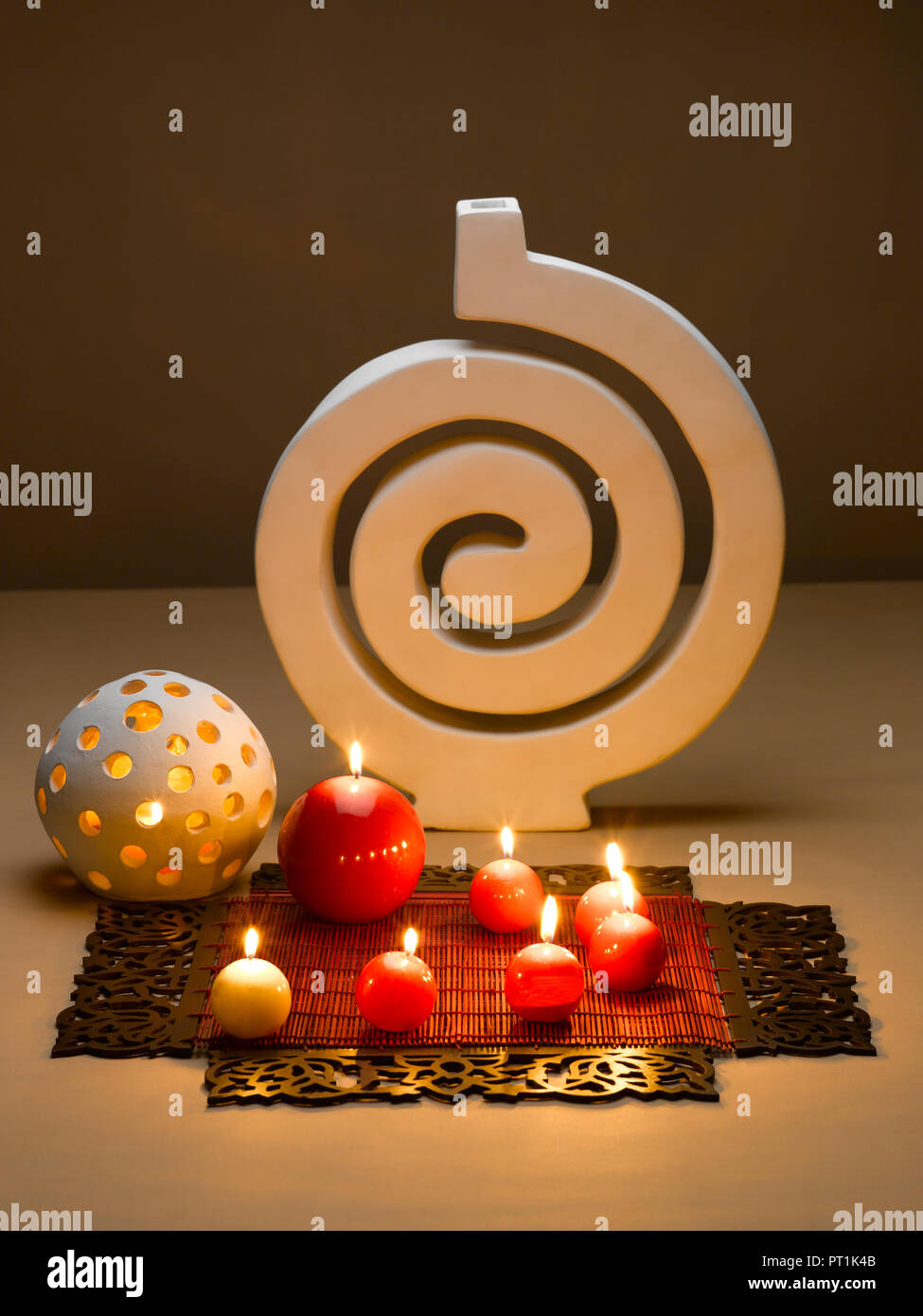 STILL LIFE OF DECORATIVE CANDLES TABLE MATS AND POT Stock Photo Alamy
