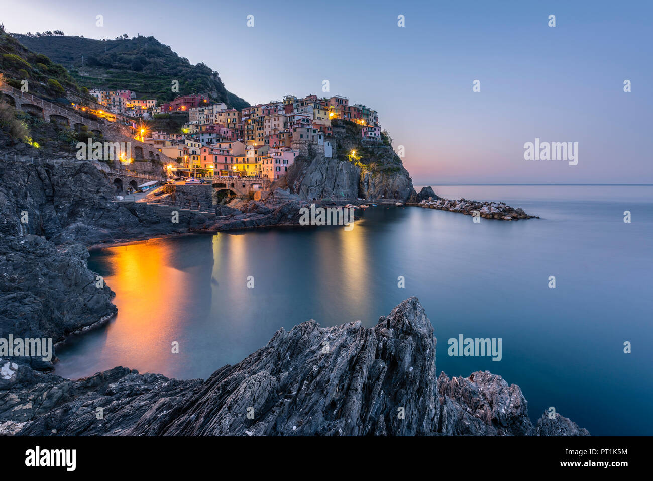 Italy, Liguria, La Spezia, Cinque Terre National Park, Manarola in the evening light Stock Photo