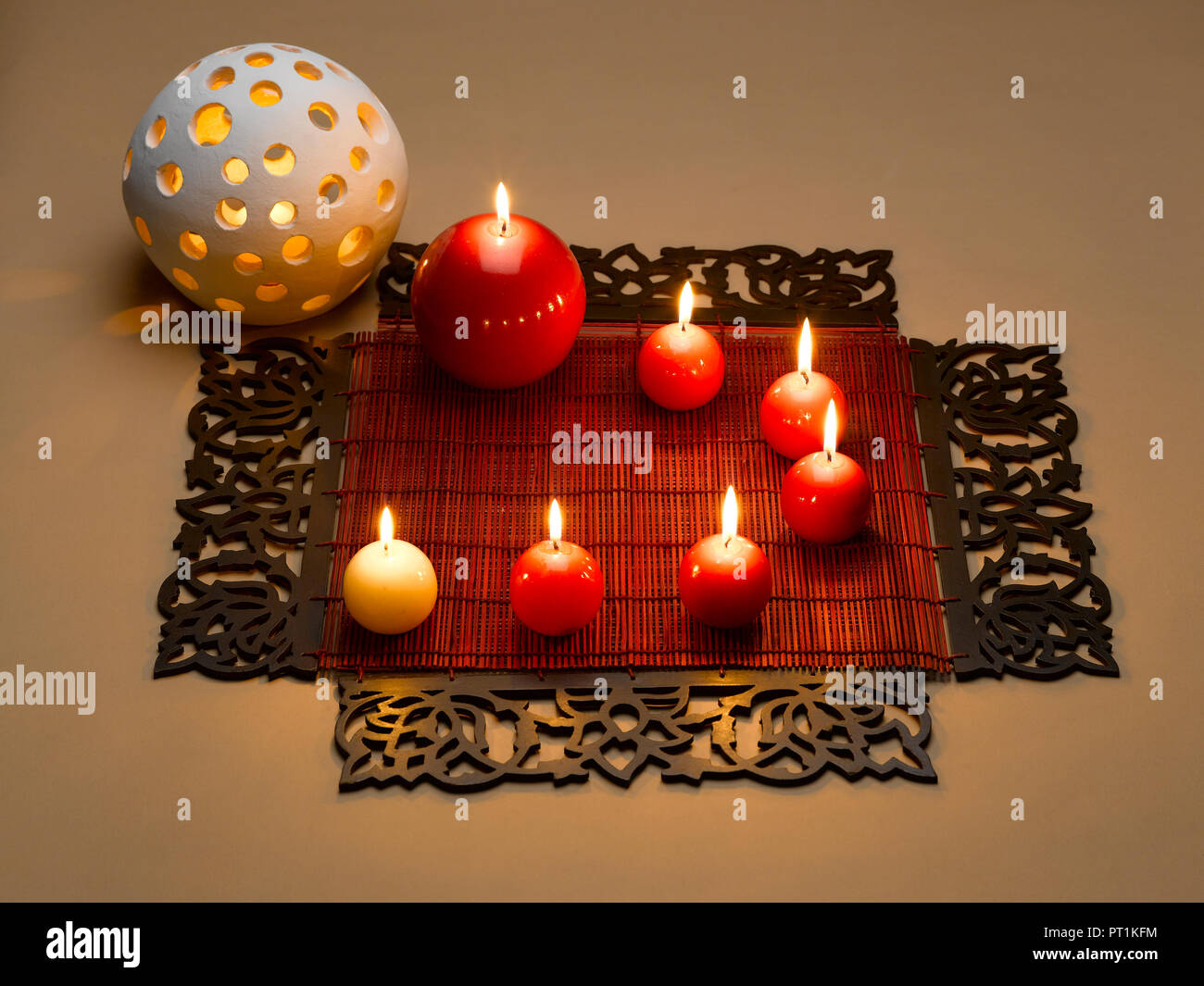 STILL LIFE OF DECORATIVE CANDLES TABLE MATS AND POT Stock Photo Alamy