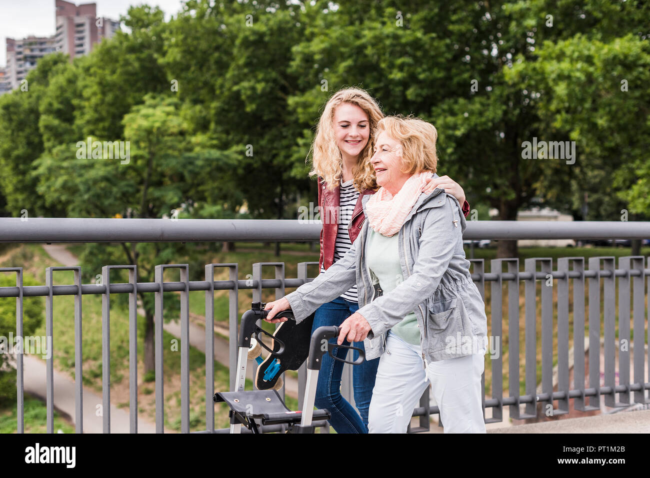 Grandmother and granddaughter strolling together Stock Photo