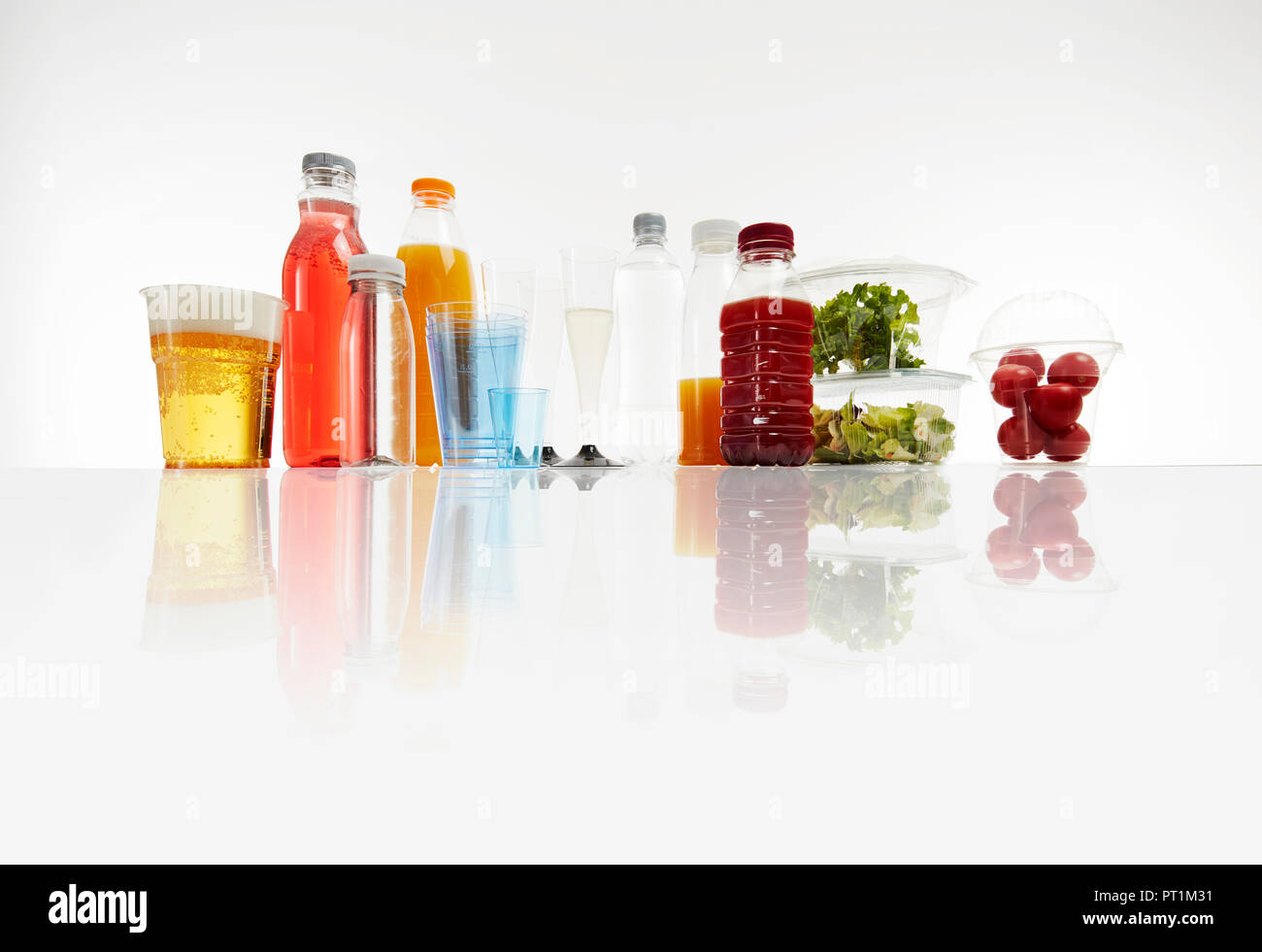 Various plastic packagings, beer, juice, cups Stock Photo