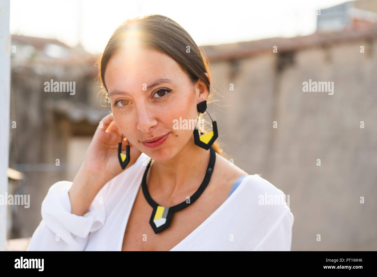 Woman with earrings hi-res stock photography and images - Alamy