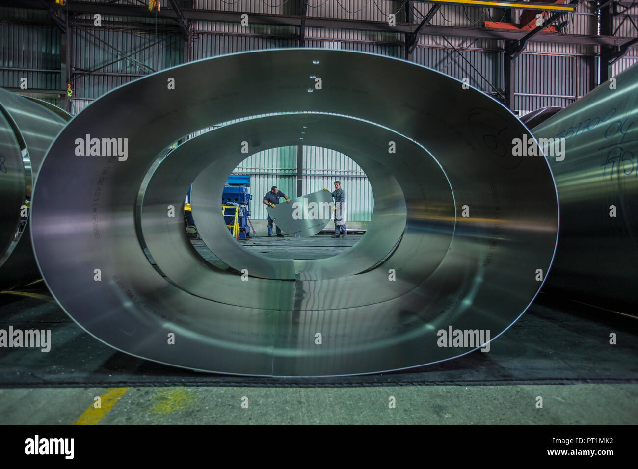 Two workers in steel factory Stock Photo