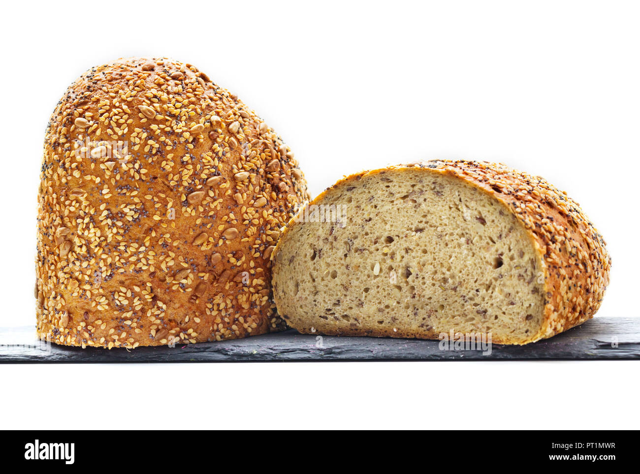 Half bread, wholemeal bread, world champion bread on slate plate, isolated Stock Photo