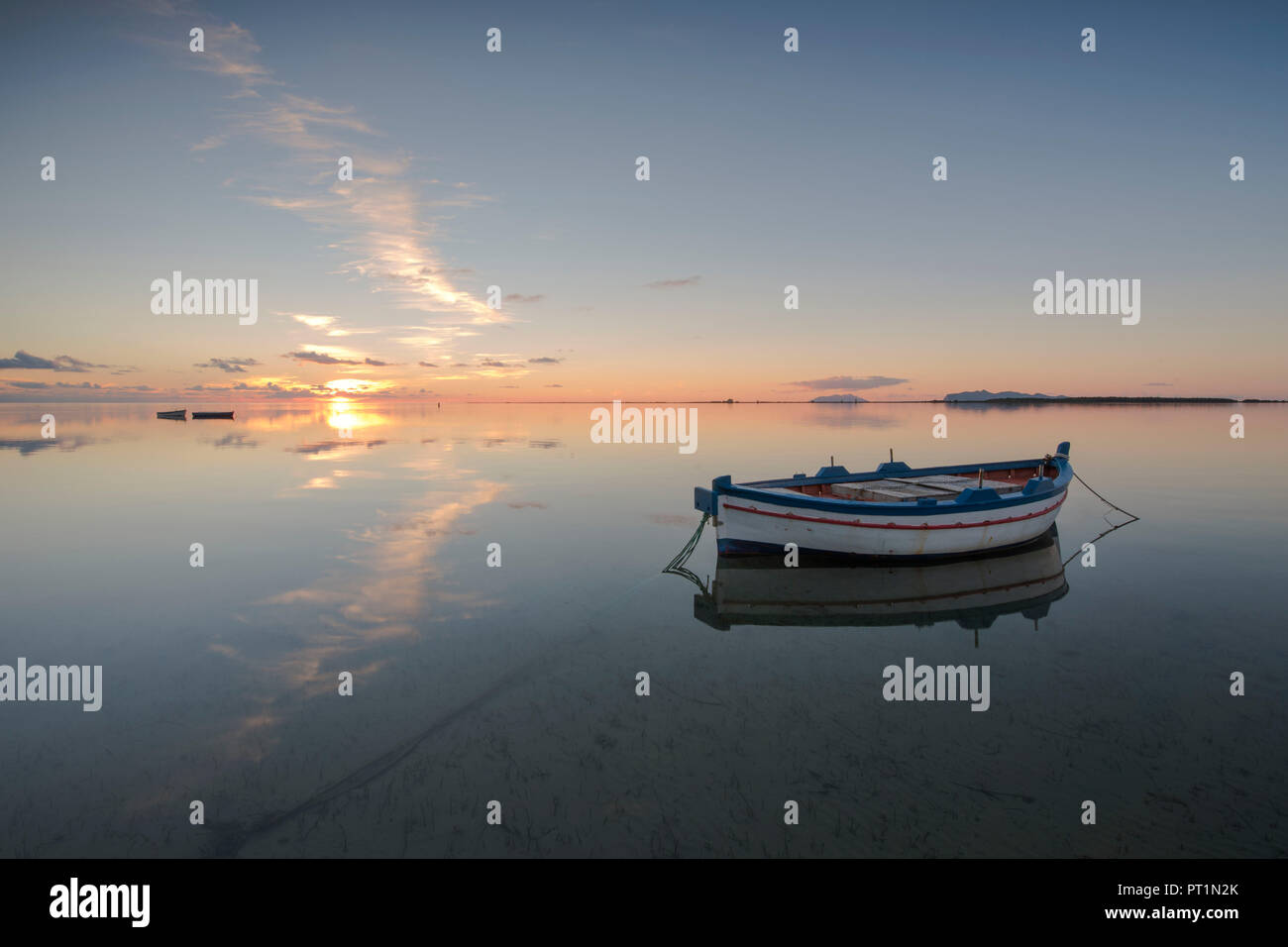 an old wooden boat in the marsala pond, trapani, sicily, Europe, European, Western Europe, Southern Europe Stock Photo