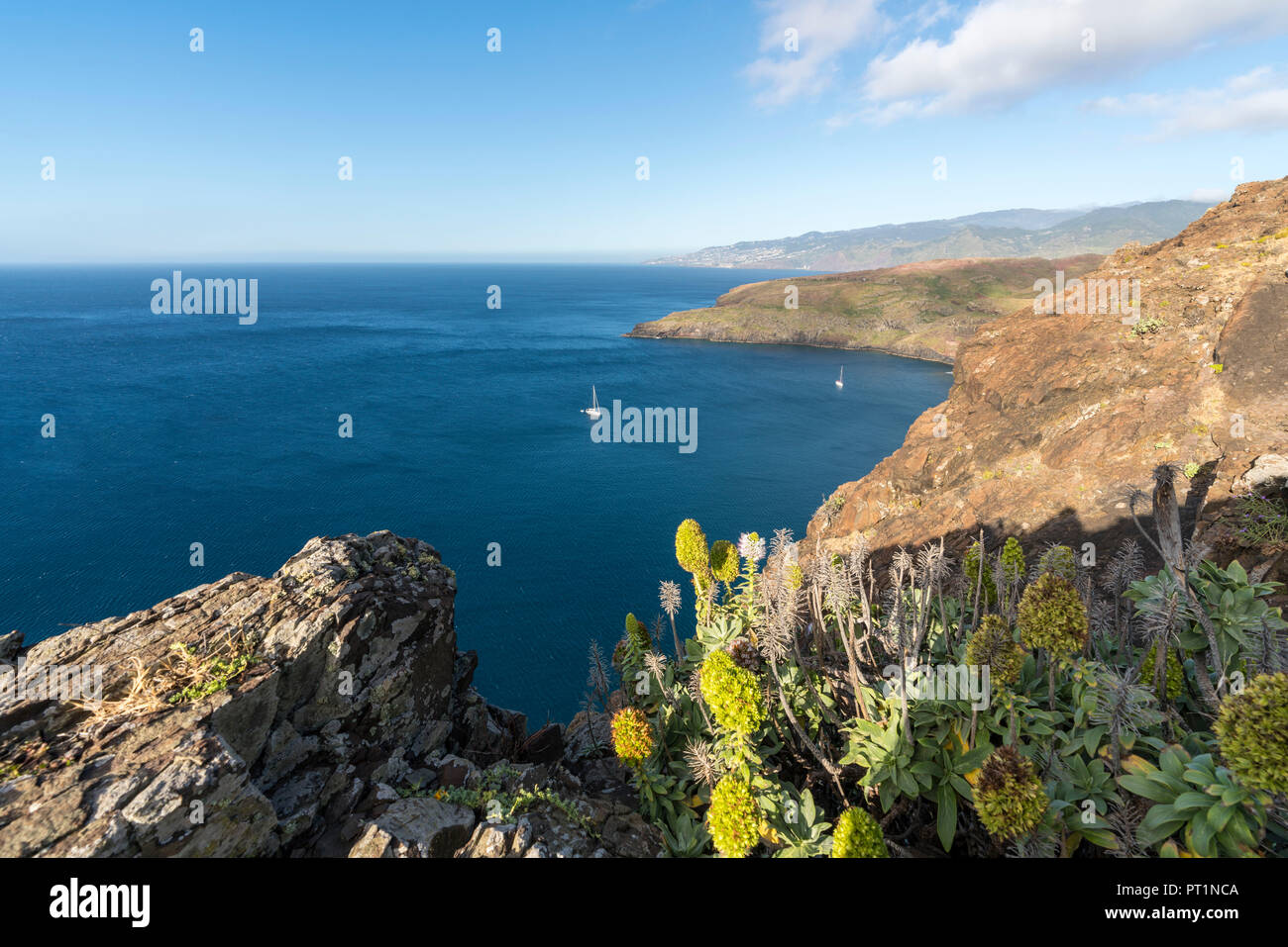 Boats sailing on the Atlantic Ocean at Point of St Lawrence, Canical, Machico district, Madeira region, Portugal, Stock Photo