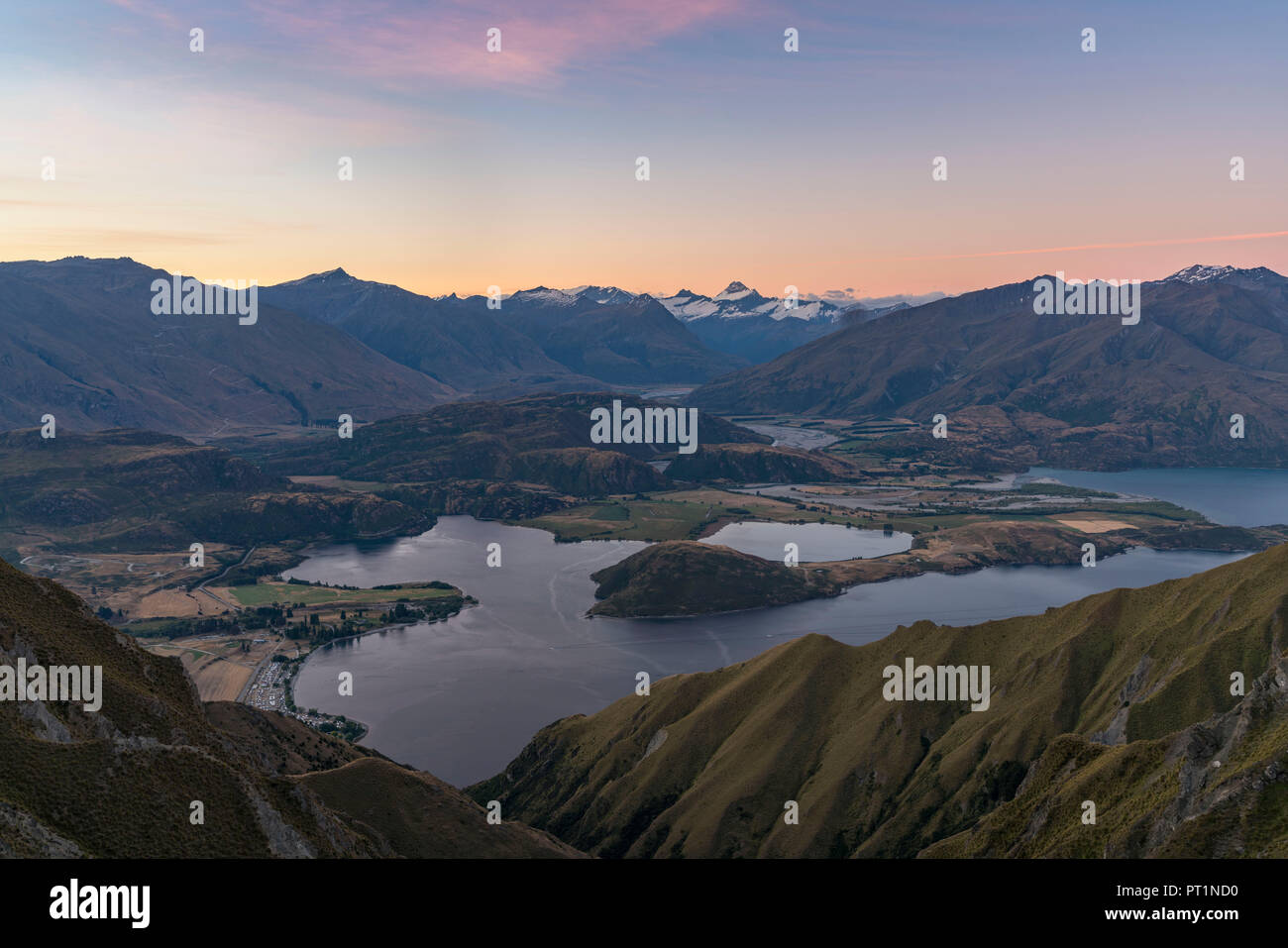 View of Glendhu Bay and Mt aspiring NP from Roys Peak lookout at sunset, Wanaka, Queenstown Lakes district, Otago region, South Island, New Zealand, Stock Photo