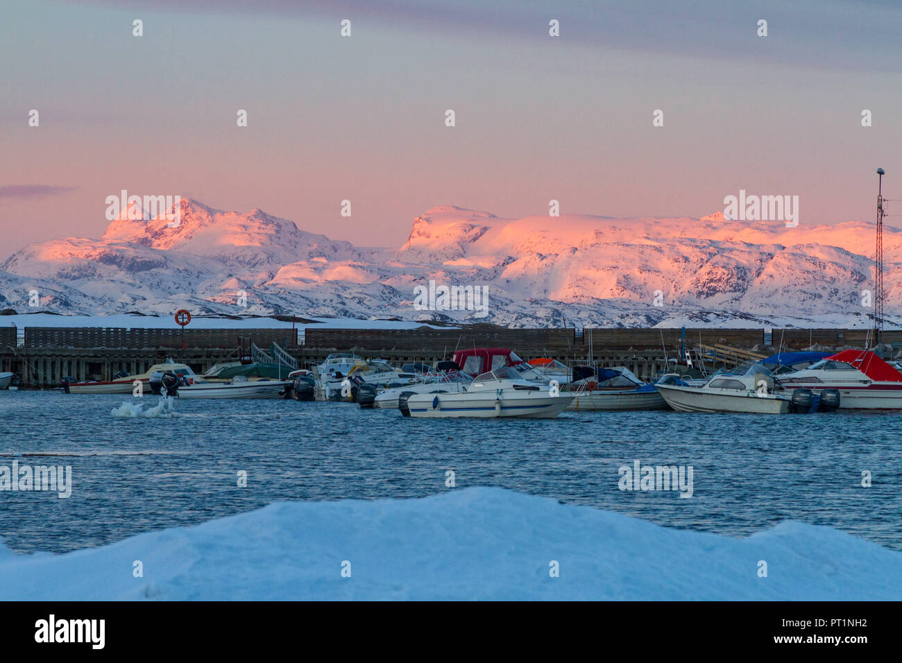 Landscape at sunrise from the port of Manitsoq, Greenland, Artic sea, Denmark Stock Photo