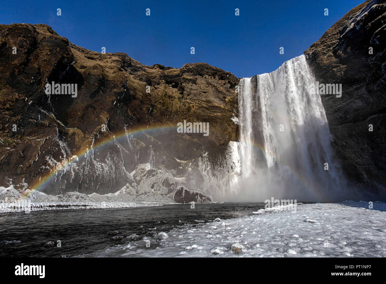 Rainbow over the Skogafoss waterfall, Skogar, Southern Iceland, Europe Stock Photo