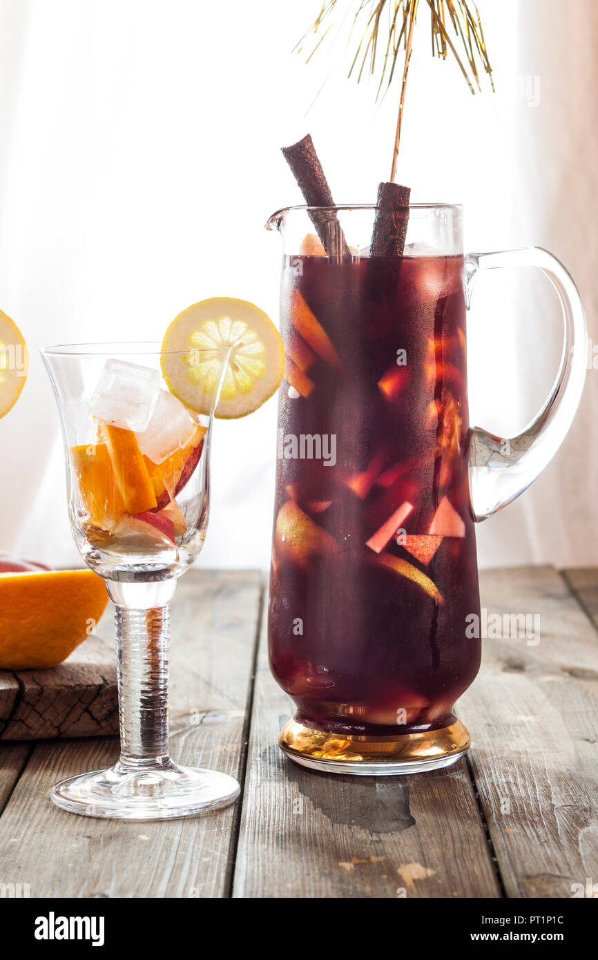 Glass carafe of Sangria with fresh fruits Stock Photo