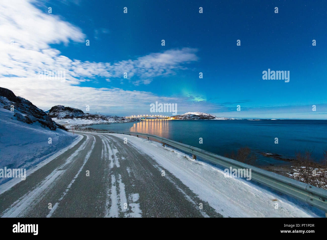 Ice on asphalt road, Sommaroy island, Troms county, Norway Stock Photo