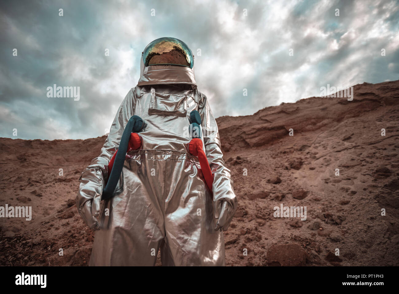 Spaceman exploring nameless planet Stock Photo