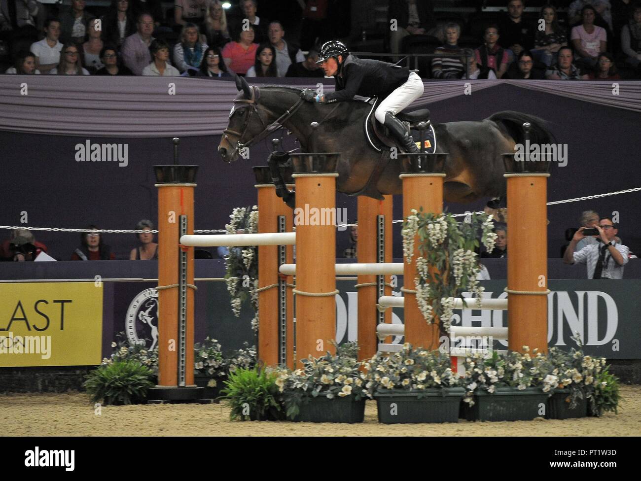 Birmingham, UK. 5th October 2018. Geoffroy De Coligny (FRA) riding 'Ramona Robinz'. International showjumping. Grandstand five fence challenge. Horse of the year show (HOYS). National Exhibition Centre (NEC). Birmingham. UK. 05/10/2018. Credit: Sport In Pictures/Alamy Live News Stock Photo