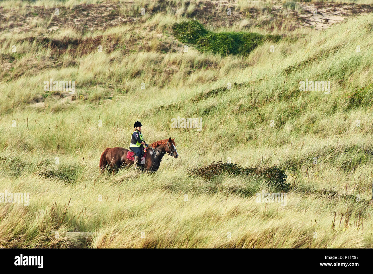 Merthyr Mawr, Wales UK. 5th October 2018. A Horse and rider enjoy the late afternoon sun and