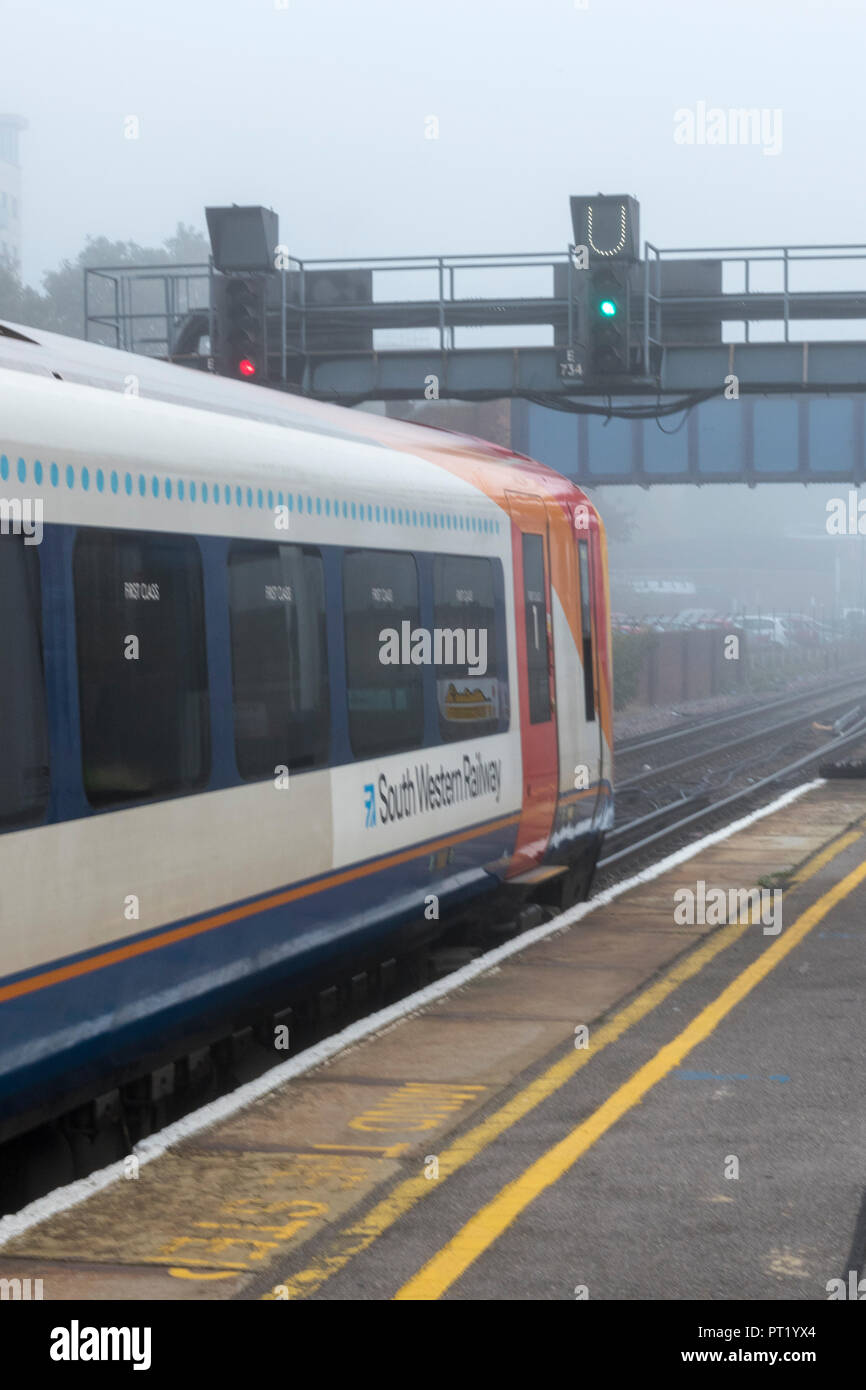 London, UK. 5th October 2018. Southwestern railway trains on a foggy moring at Southamton railway station on the first day of further industrial action by Guards in reaction to no deal with the train operating company on the future role of Guards on trains. Traincrew striking and managers running trains providing a greatly reduced service for the travelling public and rail season ticket holders commuting into London Waterloo. Credit: Steve Hawkins Photography/Alamy Live News Stock Photo