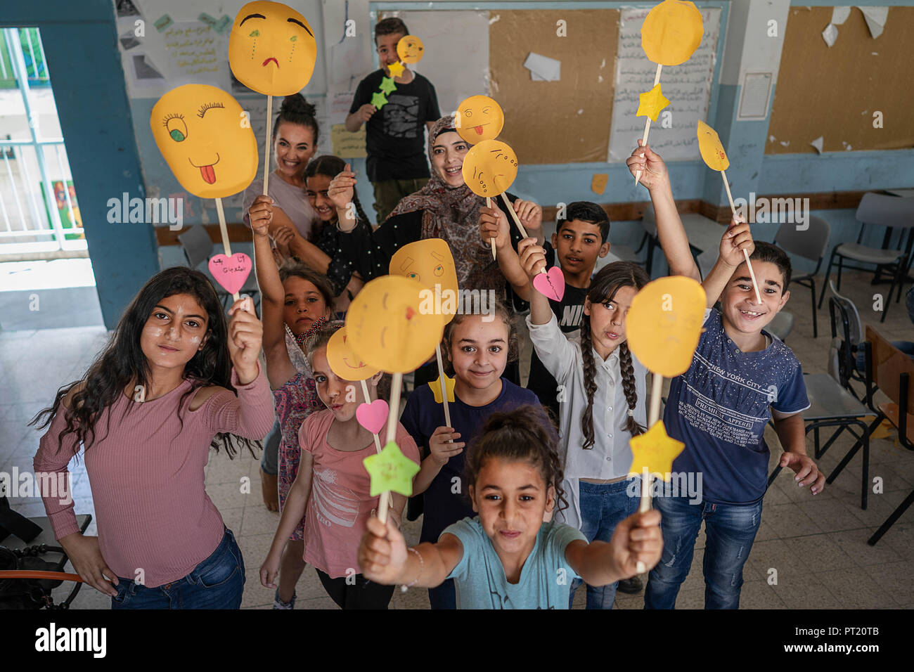 Bethlehem, Palestine. 8th Feb, 2018. Children are seen holding their emotion faces in the arts and crafts class during the summer camp.The Return Summer Camp was organised for children of the Aida refugee camp, it was established in 1950 by the Palestinians who were expelled from their homes from 27 towns throughout Palestine, namely Nasra, Tabaria, Jerusalem, Acre, Jaffa, Haifa and Hebron. This is a 4th generation of refugees, 130 children ranging from 4 to 16 years of age being overlooked by 20 instructors and volunteers and it was funded by the UN until 2000. (Credit Image: © Enzo Tom Stock Photo