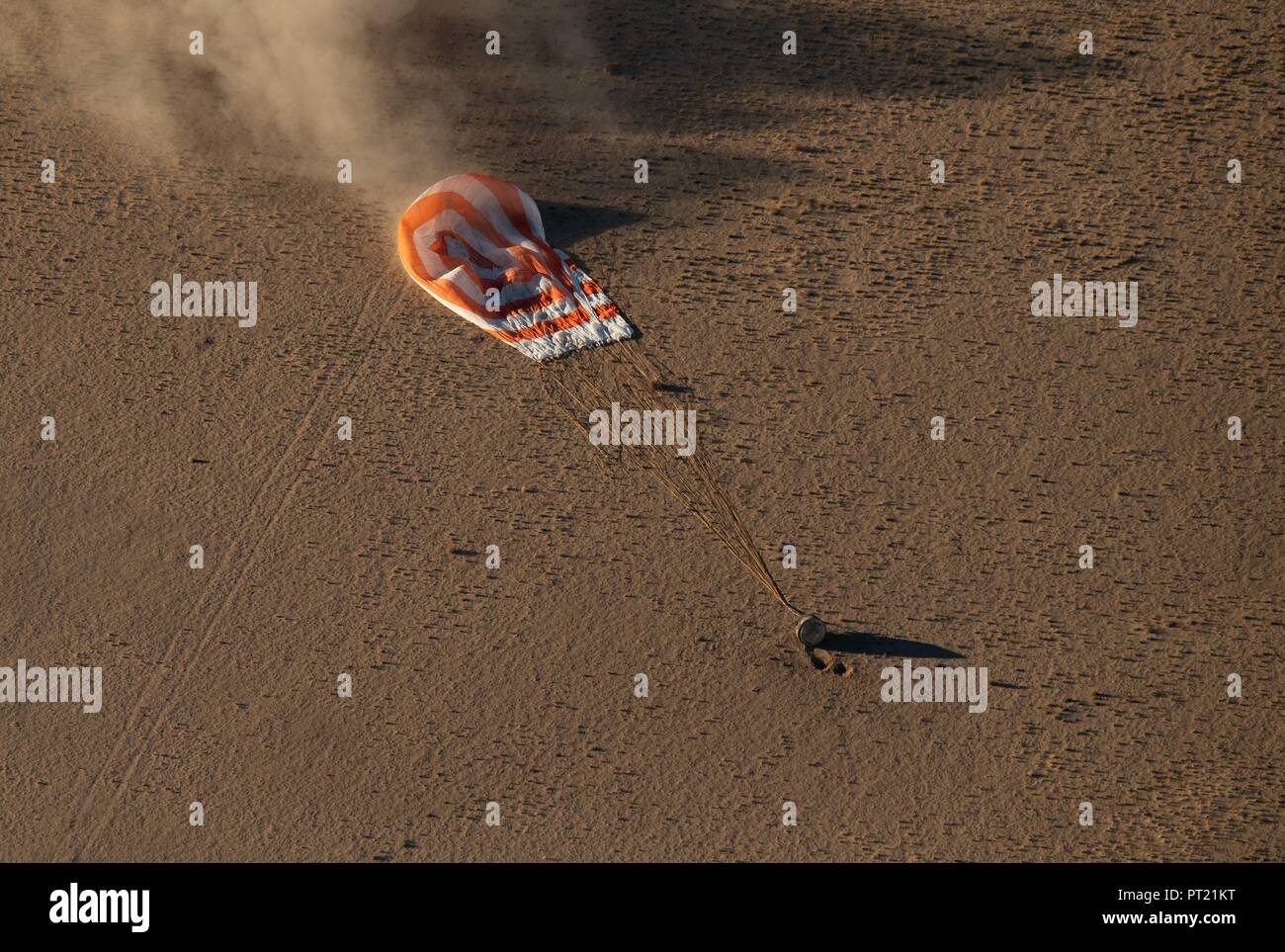 Zhezkazgan, Kazakhstan. 04th Oct, 2018. The Russian Soyuz MS-08 spacecraft lands with the International Space Station Expedition 56 crew October 4, 2018 near Zhezkazgan, Kazakhstan. American astronauts Drew Feustel and Ricky Arnold of NASA, along with Russian Soyuz Commander Oleg Artemyev are returning after 197 days in space. Credit: Planetpix/Alamy Live News Stock Photo