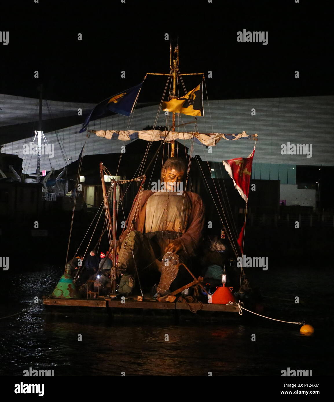 Liverpool, UK. 5 October 2018. Giant puppet resting on a floating raft