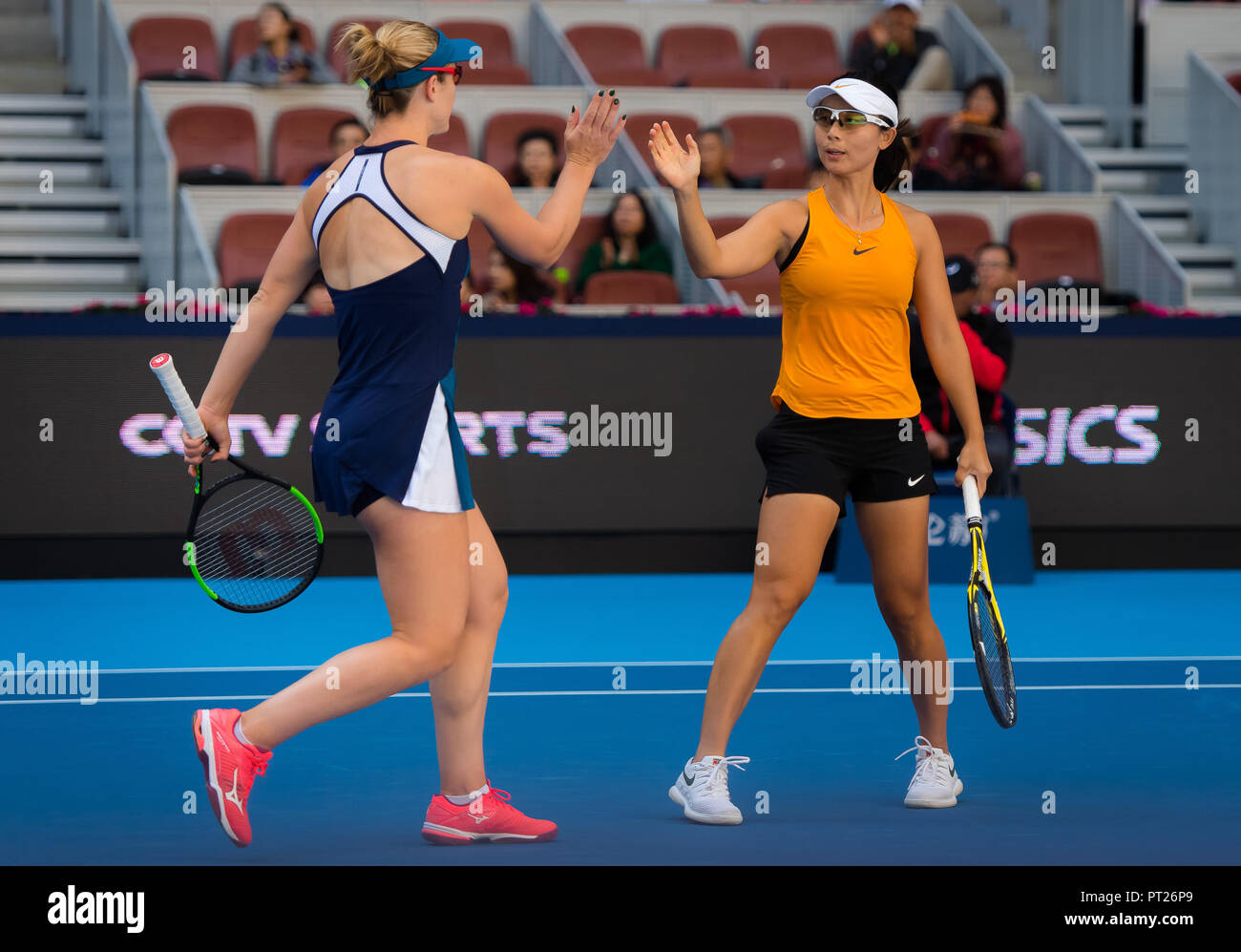 Beijing, China. October 6, 2018 - Gabriela Dabrowski of Canada & Yifan Xu  of China in action during a doubles match at the 2018 China Open WTA  Premier Mandatory tennis tournament Credit: