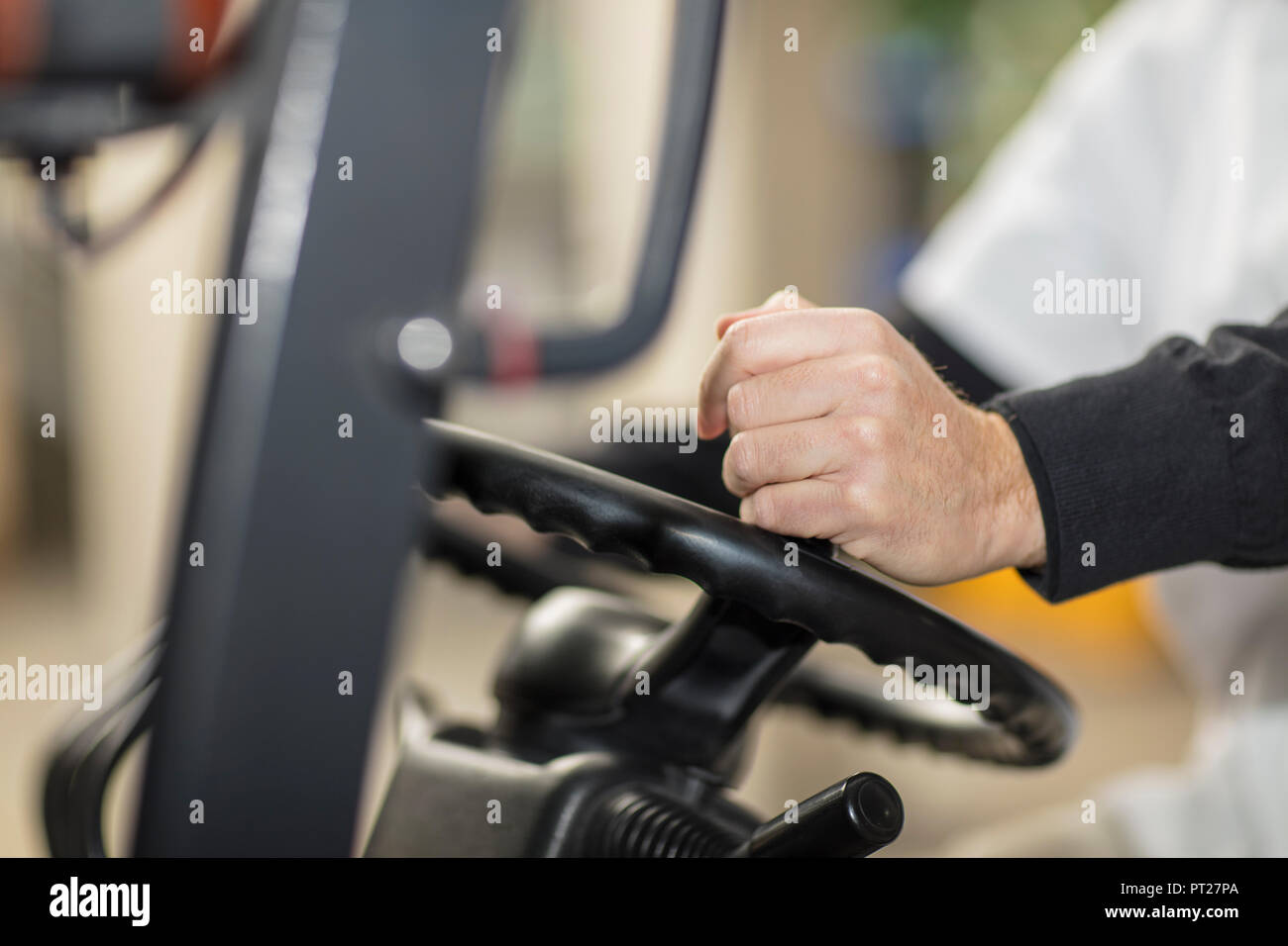 Worker driving forklift Stock Photo