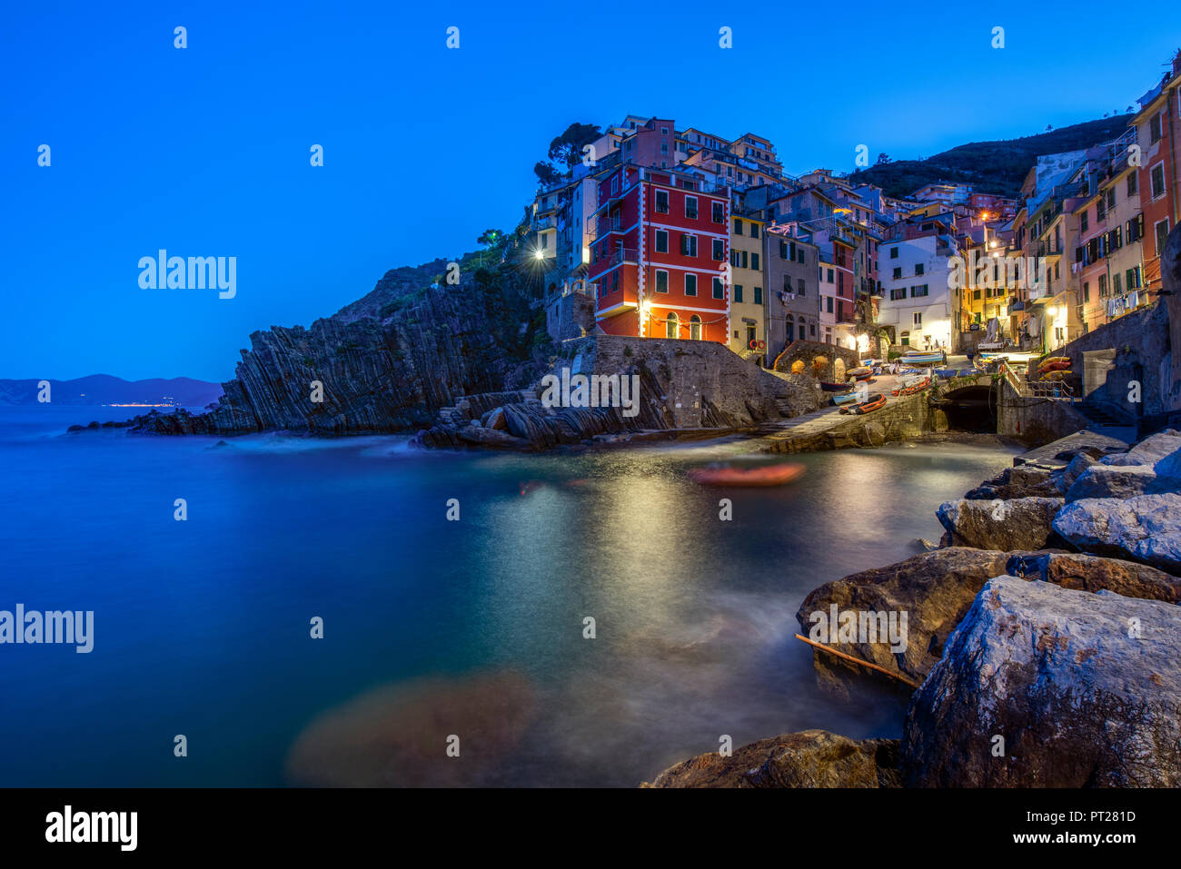 Italy, Liguria, La Spezia, Cinque Terre National Park, Riomaggiore at blue hour Stock Photo