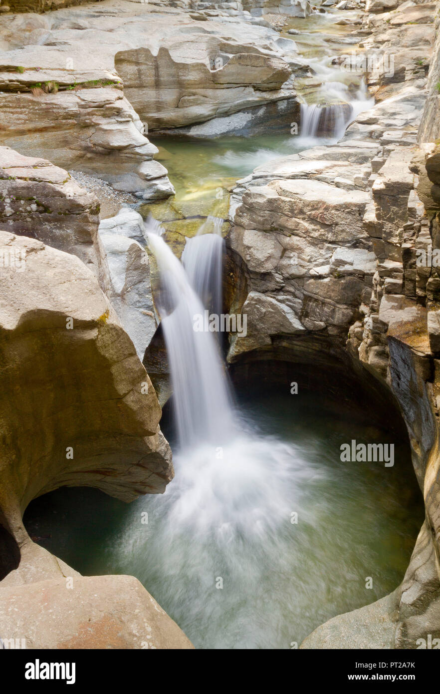 A small water fall in the Cavaglia potholes in Poschiavo valley, Switzerland, Europe Stock Photo