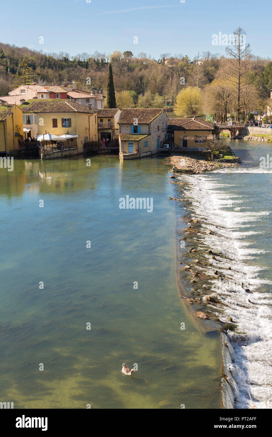 Housing complex on river Mincio, Valeggio sul Mincio, Verona province, Veneto region, Italy, Stock Photo