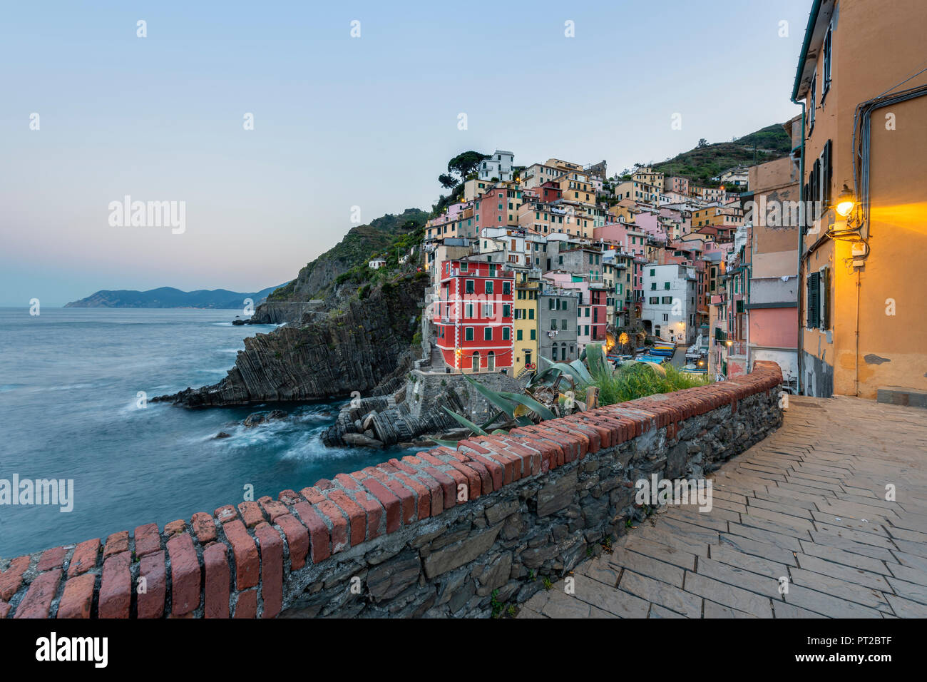 Italy, Liguria, La Spezia, Cinque Terre National Park, Riomaggiore in the evening light Stock Photo