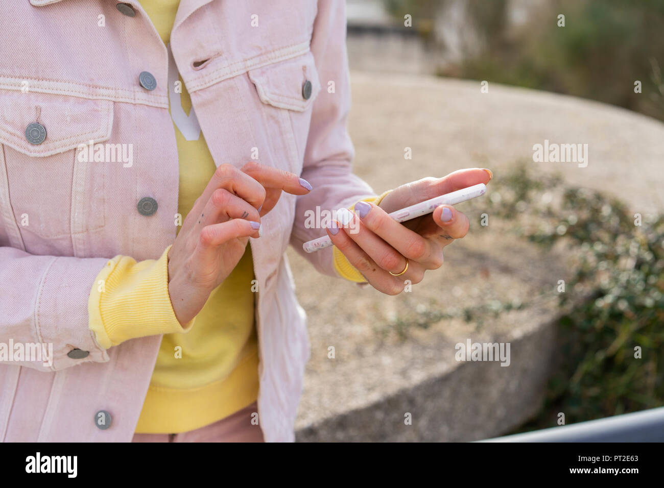 Young woman using smartphone Stock Photo