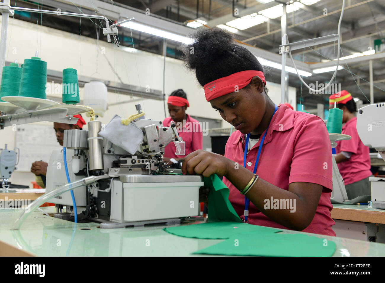ETHIOPIA , Southern Nations, Hawassa or Awasa, Hawassa Industrial Park, chinese-built for the ethiopian government to attract foreign investors with low rent and tax free to establish a textile industry and create thousands of new jobs, taiwanese company Everest Textile Co. Ltd.produces textiles from synthetic fabric for export / AETHIOPIEN, Hawassa, Industriepark, gebaut durch chinesische Firmen fuer die ethiopische Regierung um die Hallen fuer Textilbetriebe von Investoren zu vermieten, taiwanesische Firma Everest Textile Co. Ltd. produziert Textilien aus synthetischen Stoffen fuer den Expor Stock Photo
