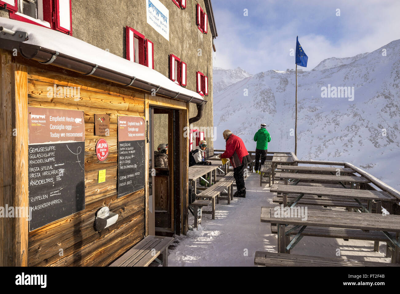 Europe, Italy, South Tyrol, Schnalstal, Kurzras, skiers on the terrace of the refuge Schöne Aussicht in the Schnalstal Stock Photo