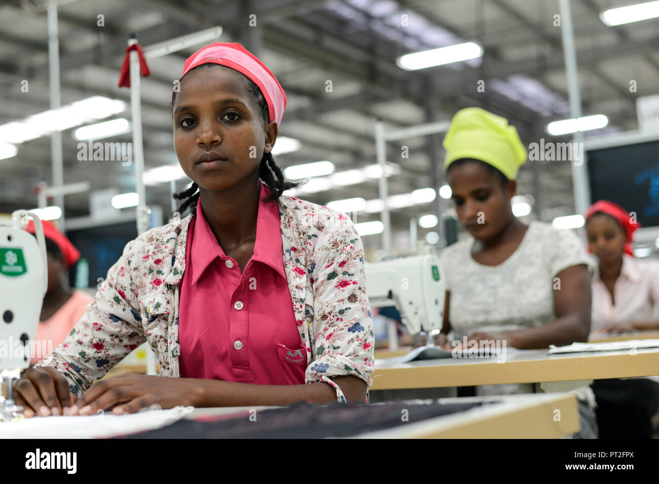 ETHIOPIA , Southern Nations, Hawassa or Awasa, Hawassa Industrial Park, chinese-built for the ethiopian government to attract foreign investors with low rent and tax free to establish a textile industry and create thousands of new jobs, taiwanese company Everest Textile Co. Ltd.produces textiles from synthetic fabric for export, training department for new worker / AETHIOPIEN, Hawassa, Industriepark, gebaut durch chinesische Firmen fuer die ethiopische Regierung um die Hallen fuer Textilbetriebe von Investoren zu vermieten, taiwanesische Firma Everest Textile Co. Ltd. produziert Textilien aus  Stock Photo