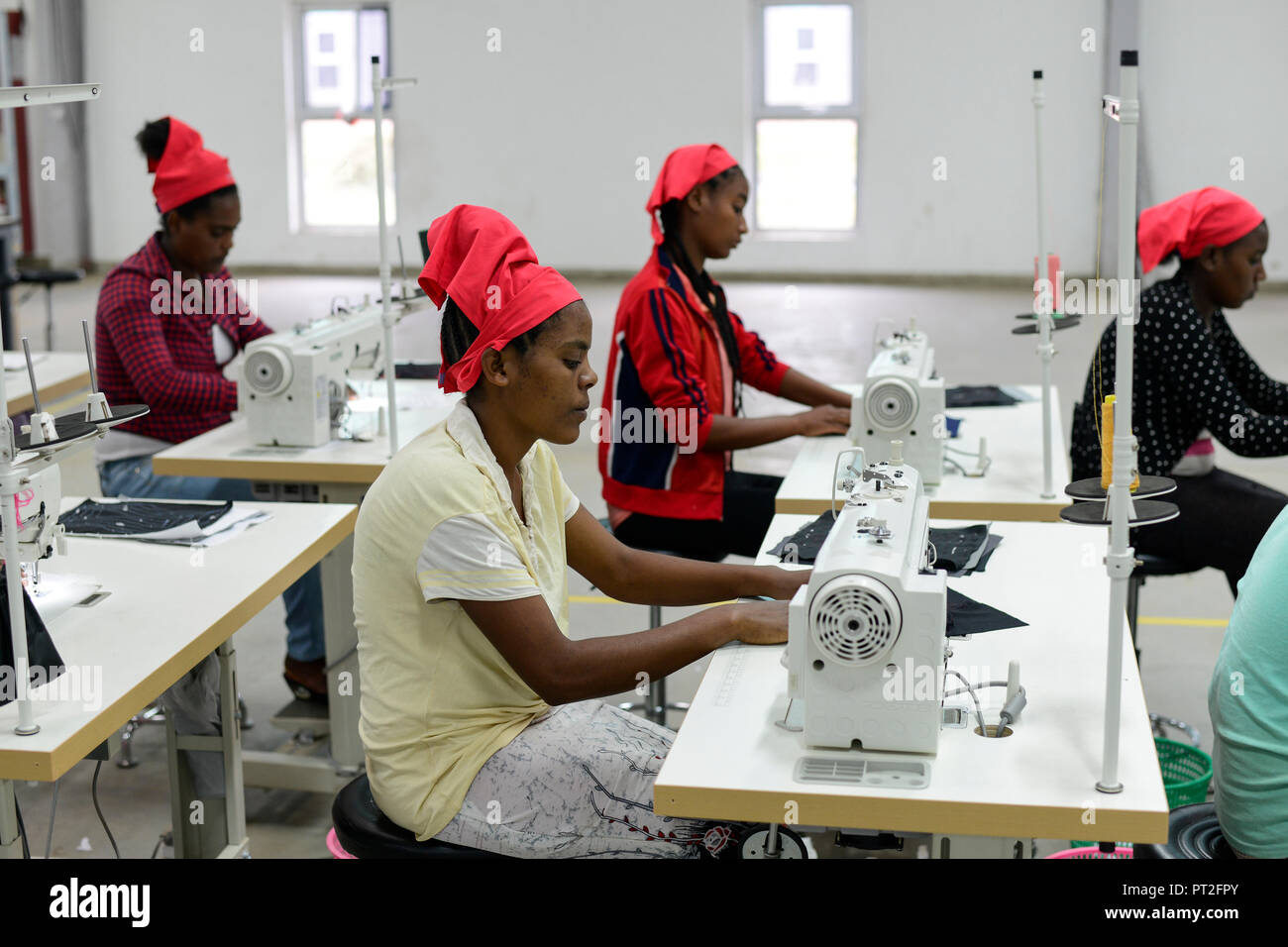 ETHIOPIA , Southern Nations, Hawassa or Awasa, Hawassa Industrial Park, chinese-built for the ethiopian government to attract foreign investors with low rent and tax free to establish a textile industry and create thousands of new jobs, taiwanese company Everest Textile Co. Ltd.produces textiles from synthetic fabric for export, training department for new worker / AETHIOPIEN, Hawassa, Industriepark, gebaut durch chinesische Firmen fuer die ethiopische Regierung um die Hallen fuer Textilbetriebe von Investoren zu vermieten, taiwanesische Firma Everest Textile Co. Ltd. produziert Textilien aus  Stock Photo
