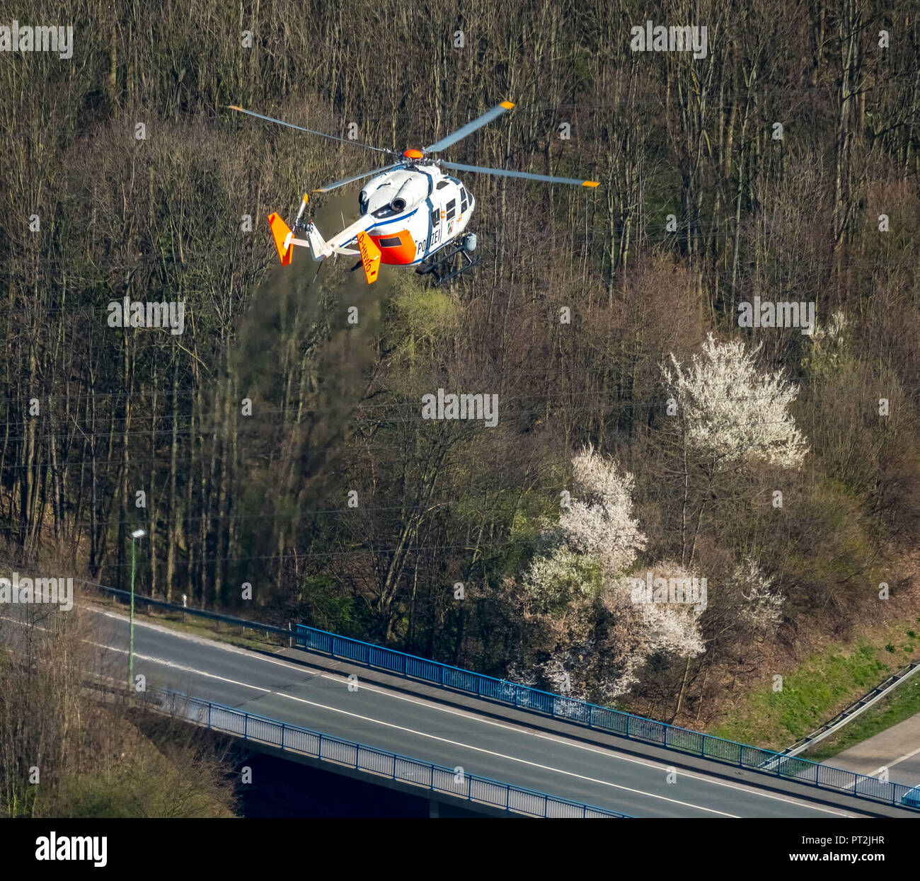 Police helicopter searching above the A46, Hagen, Ruhr area, North Rhine-Westphalia, Germany Stock Photo