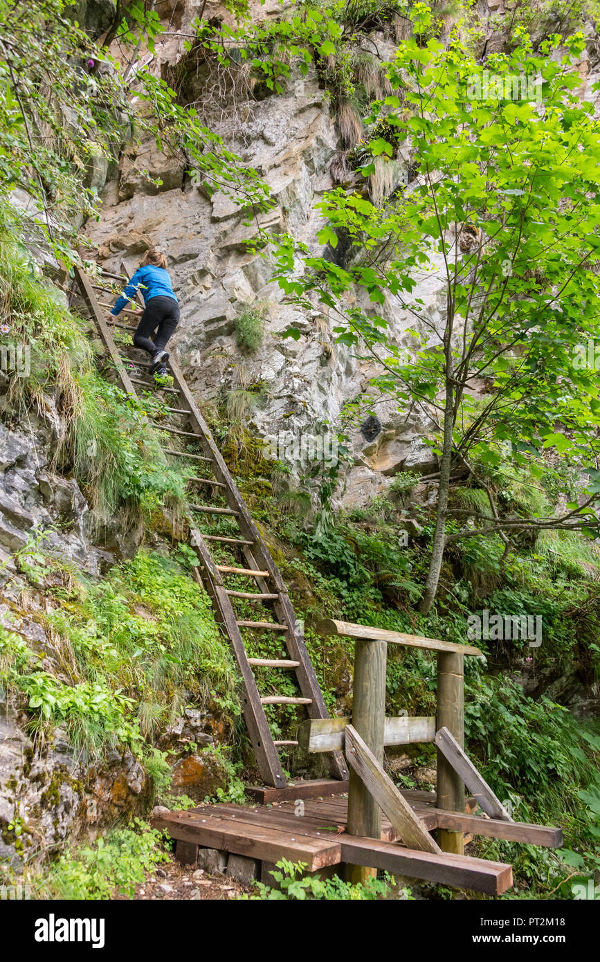 Switzerland, canton Valais, district Leuk, Albinen, Albinenleitern, hike, Leukerbad to Albinen, hikers, woman climbing Albinenleitern Stock Photo