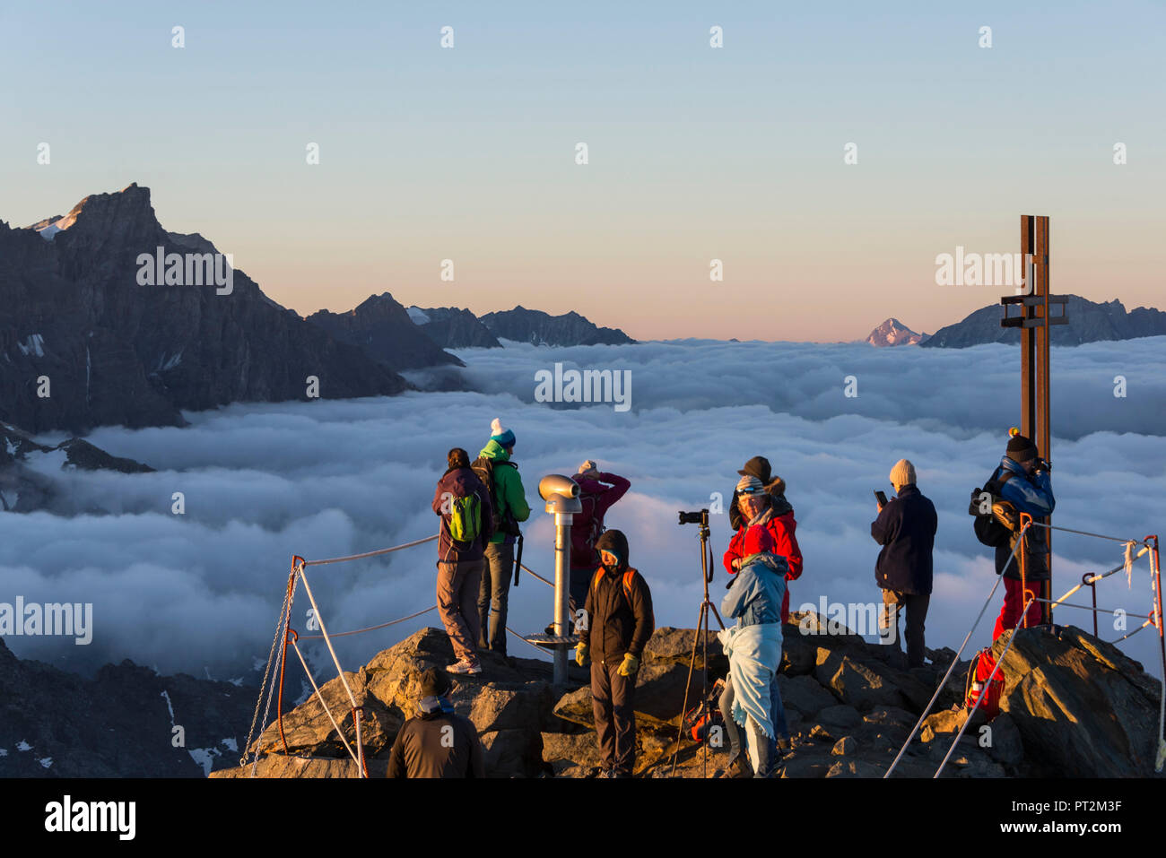 Switzerland, canton Valais, district Entremont, Verbier, sunrise, 3329 m high Mont-Fort, people enjoying the view Stock Photo