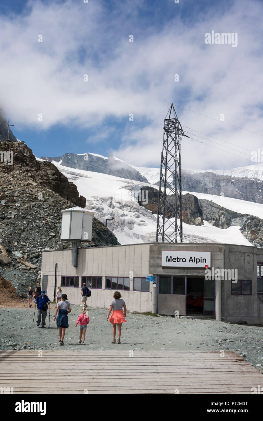 Switzerland, canton Valais, Verbier, high plateau, Saas Valley, Saas-Fee, Fee Glacier, Metro Alpin, the highest underground in the world with terminus at 3456 m, people in front of the entrance of the Metro Alpin Stock Photo