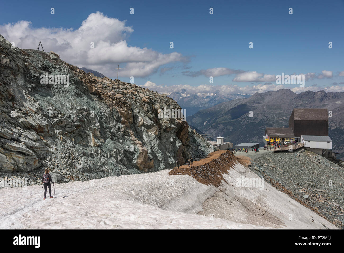 Switzerland, canton Valais, Verbier, high plateau, Saas Valley, Saas-Fee, Fee Glacier, Felskinnbahn, Mittelallalin, Britannia hut, hiker following the trail Stock Photo
