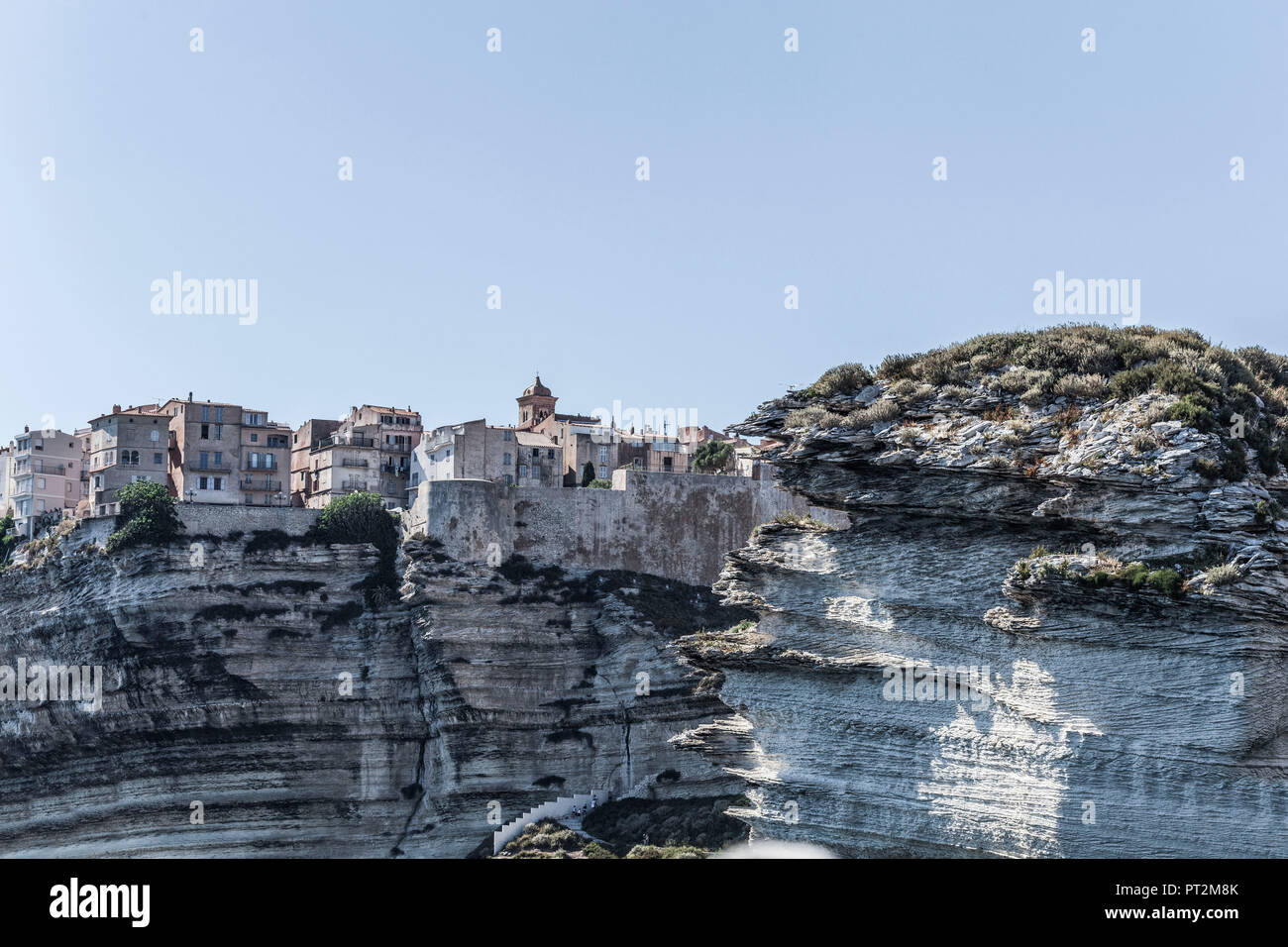 View of Bonifacio, Corsica and the rugged rocks from the sea Stock Photo