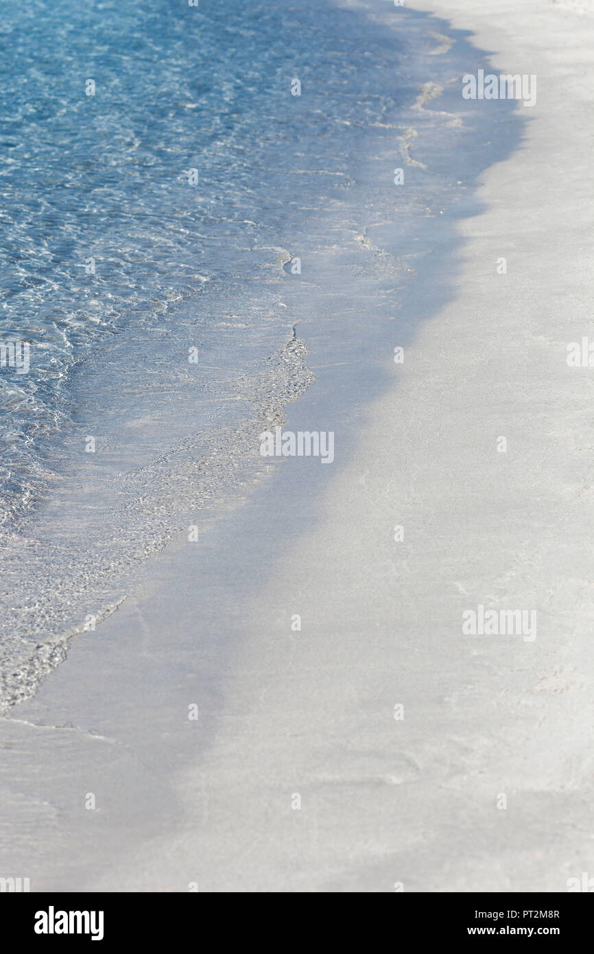 Small waves break at the fine sand, lonely beach of Palombaggia, Corsica Stock Photo