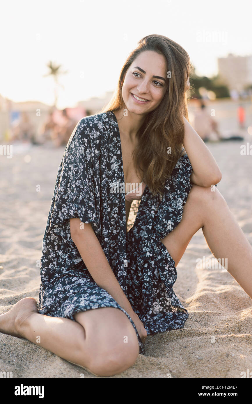 Beautiful woman on the beach at sunset Stock Photo