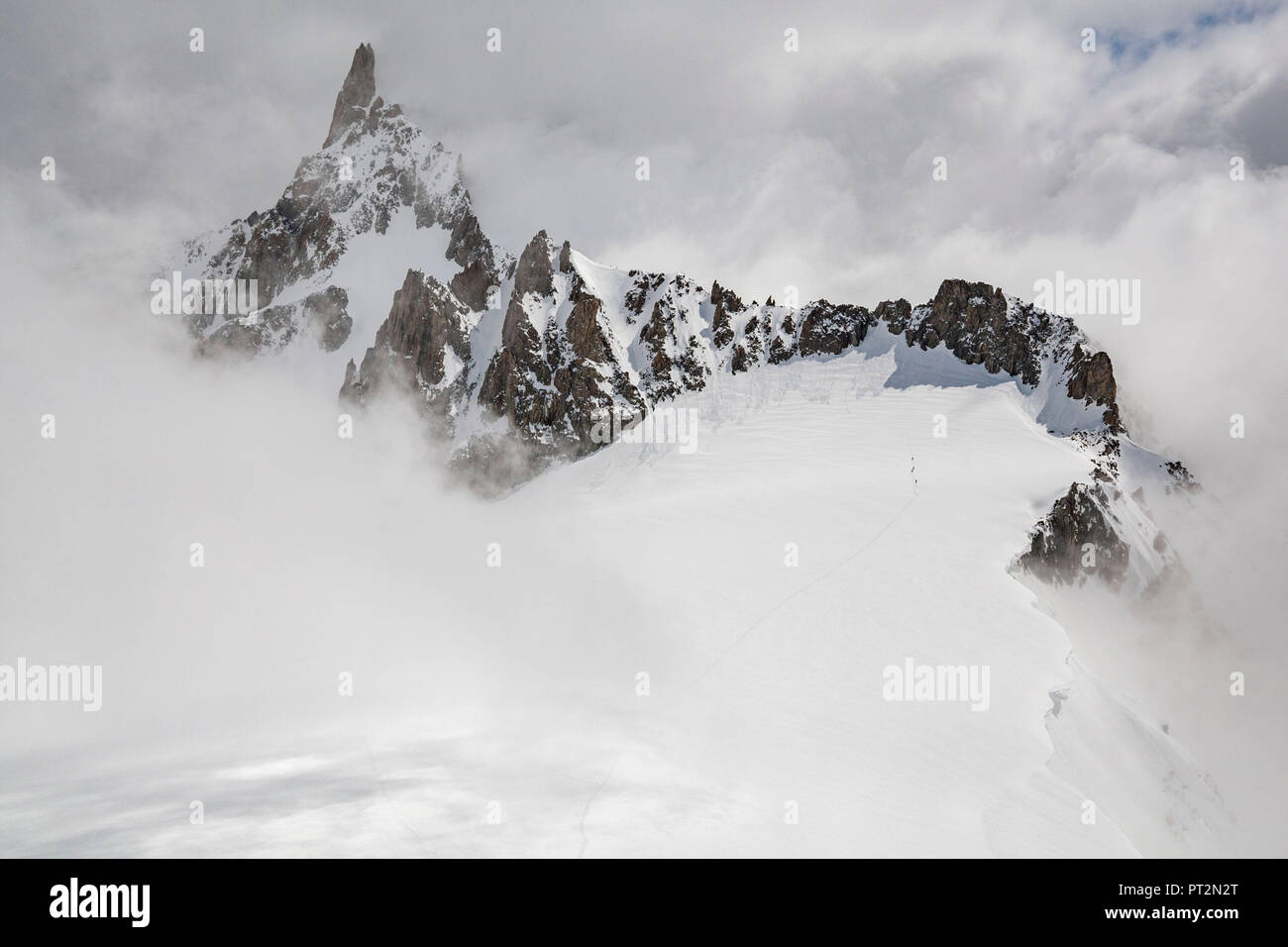 Glacier and Dente del Gigante hidden in the fog, Skyway, Courmayeur, Aosta Valley, Italy Stock Photo