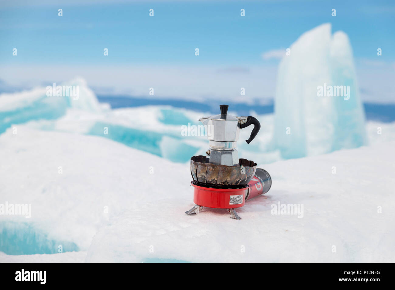 Italian coffe machine Moka on the blocks of ice, Lake Baikal, Irkutsk region, Siberia, Russia Stock Photo