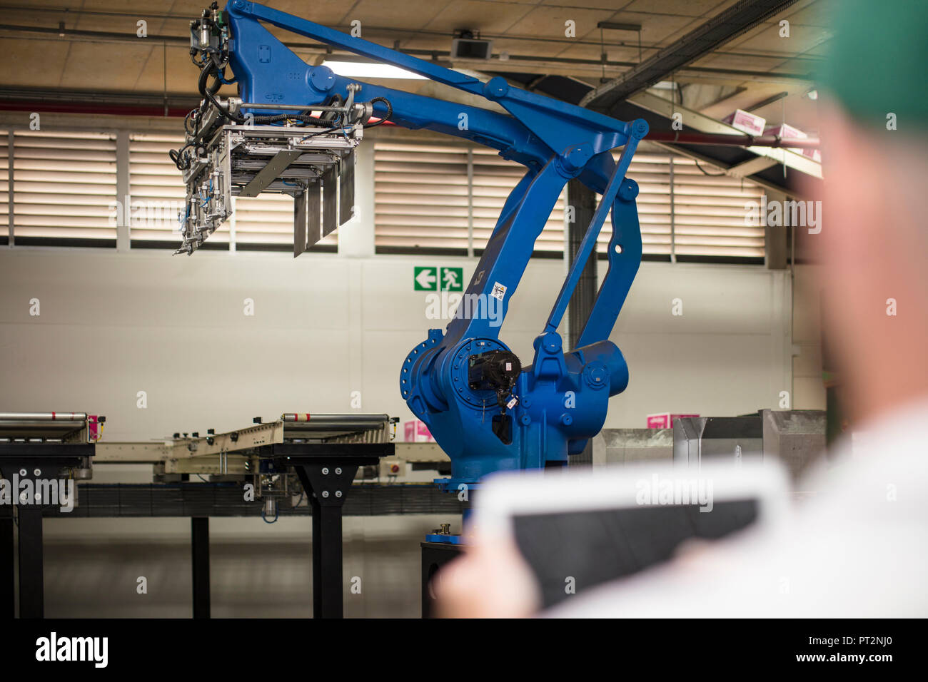 Worker using tablet in factory Stock Photo