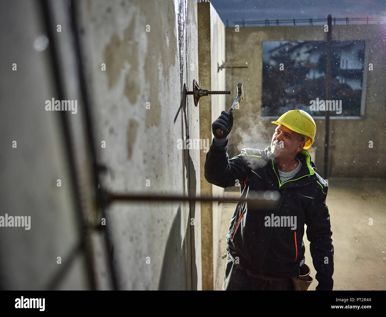 Construction worker fitting with hammer the iron rod Stock Photo Alamy